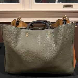 Rogue 39 In Colorblock. Natural pebble leather. Fits a 13" laptop.